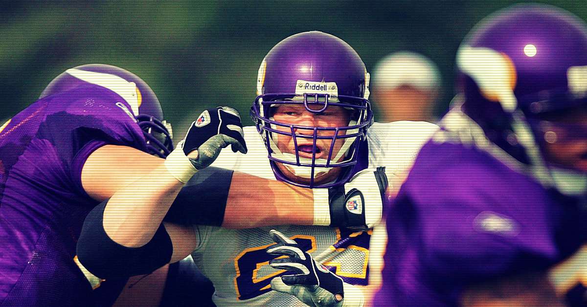 Brock Lesnar is blocked by a defender in NFL training camp for the minnesota vikings