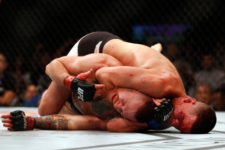 Nate Diaz taps out Conor McGregor during their first pay per view fight in the UFC.