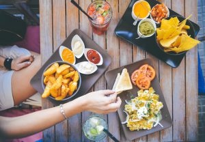an appetizer spread at an upscale outdoor eatery showing how to prevent a hangover