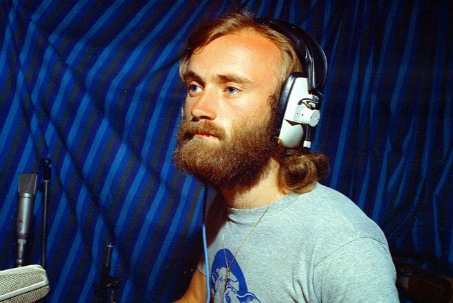 Phil Collins in the studio wearing headphones in the 1970s