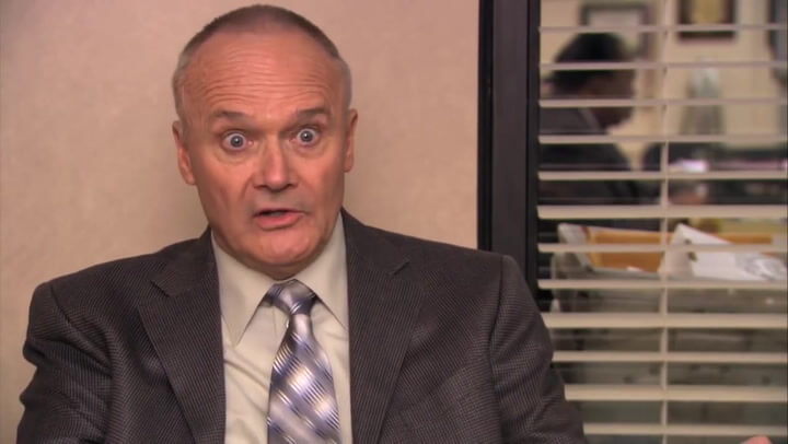 creed bratton looking crazy and wild.