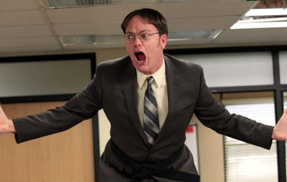 Dwight Schrute freaking out in the office, causing a ruckus.