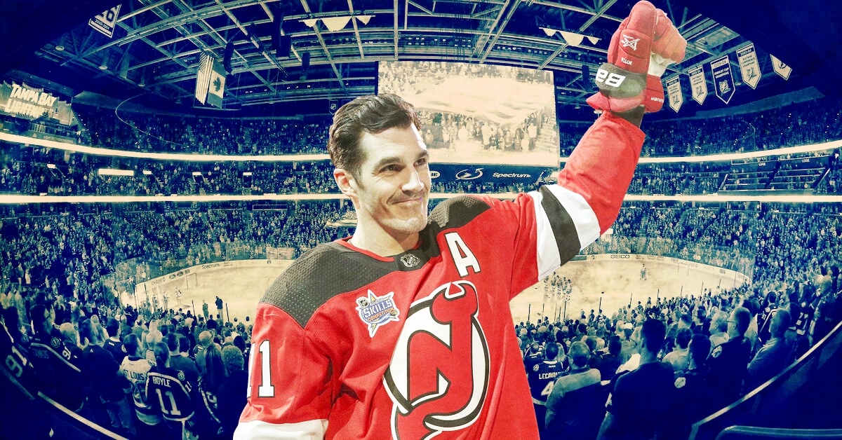 Brian Boyle Cancer and Perseverance cover illustration. Brian Boyle raises his arm in acknowledgement of the cheering fans at the 2018 NHL All-Star Game.