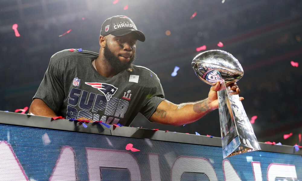 James White holds out the Lombardi Trophy after scoring 4 touchdowns against the Atlanta Falcons in Super Bowl 51