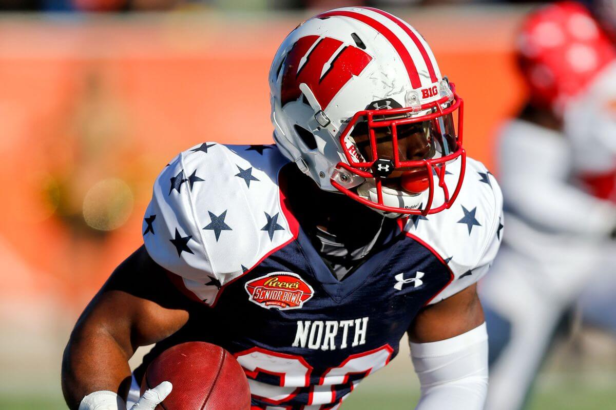 James White carries the ball in the 2014 Senior Bowl, looking to up his stock before the 2014 NFL Draft.