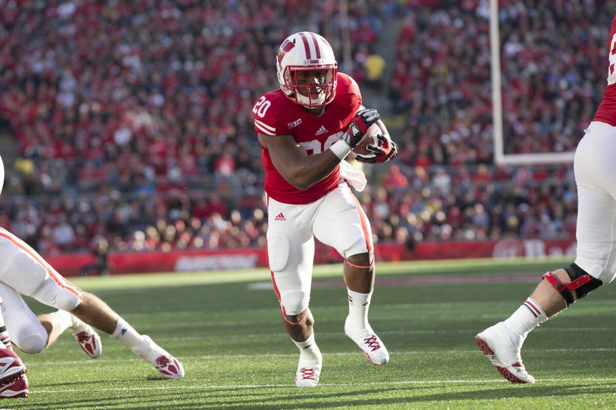 James White carries the football for the Wisconsin Badgers in 2013.