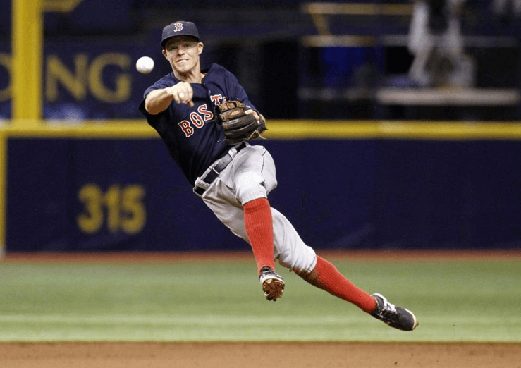 Brock Holt, Boston's glue guy, fires a throw to first at Tropicana Field in Tampa Bay