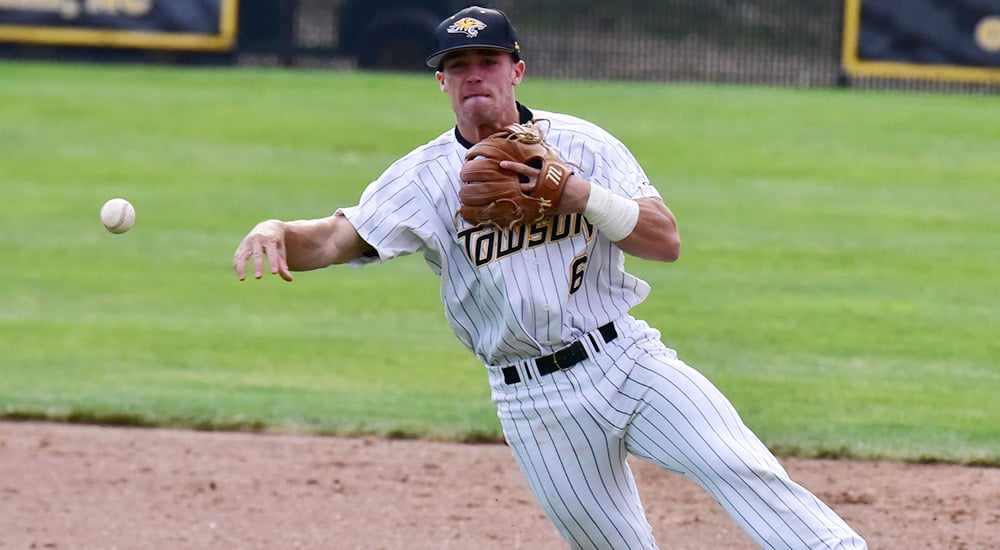Brady Policelli fires to first base on a tough backhand stop at Towson against Navy