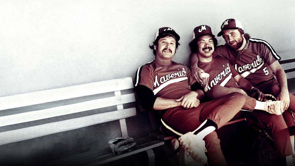 Portland Mavericks teammates, including Jon Yoshiwara (middle), hang out in the dugout in the 1970's, pulled from the Netflix documentary 'The Battered Bastards of Baseball'.