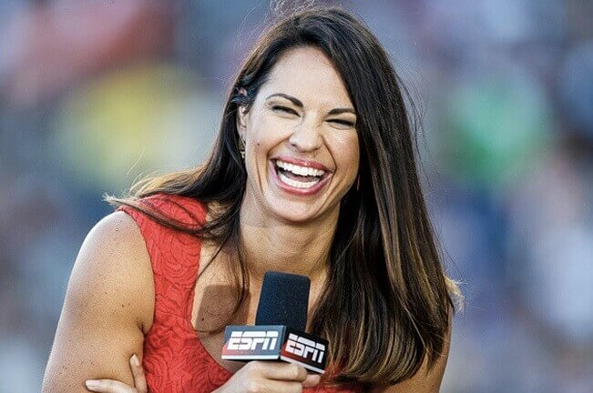 Jess Mendoza laughs at the haters while working for ESPN on an MLB field. 