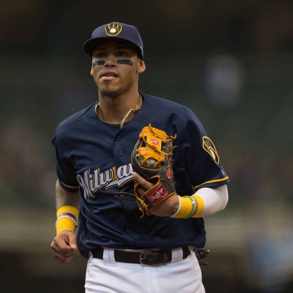 Orlando Arcia trots off the field wearing the Brewers alternate uniform and cap