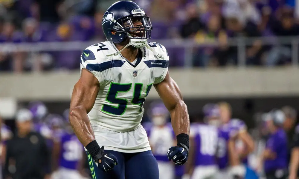 Former 2-star recruit Bobby Wagner flexes after making a big stop for the Seattle Seahawks defense
