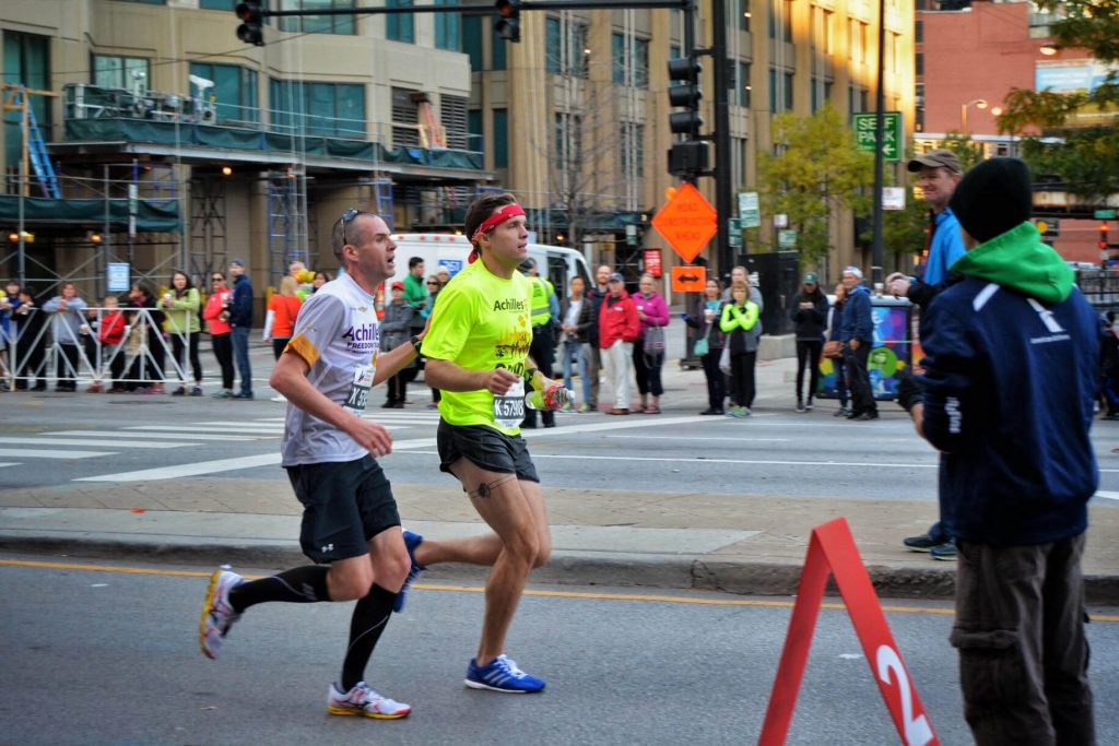 A blind runner is led by his guide for the 26.2 mile Chicago Marathon