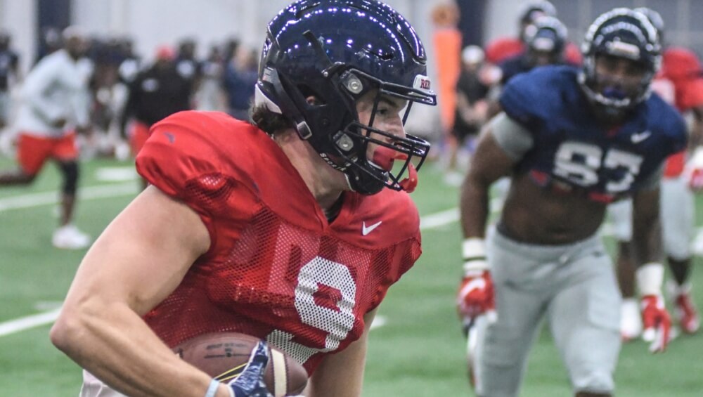 Dawson Knox avoids tacklers at an Ole Miss Rebels football practice