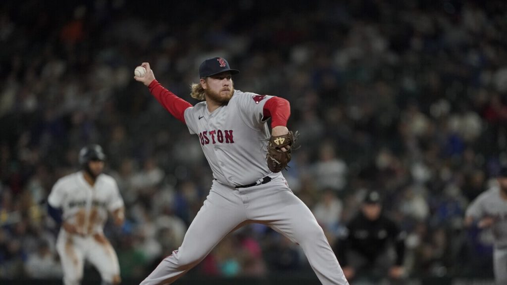 Kaleb Ort winds up to throw a pitch in his MLB debut with the Red Sox