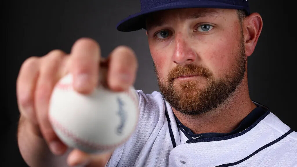 Close-up of pitcher Kirby Yates gripping a four-seam fastball