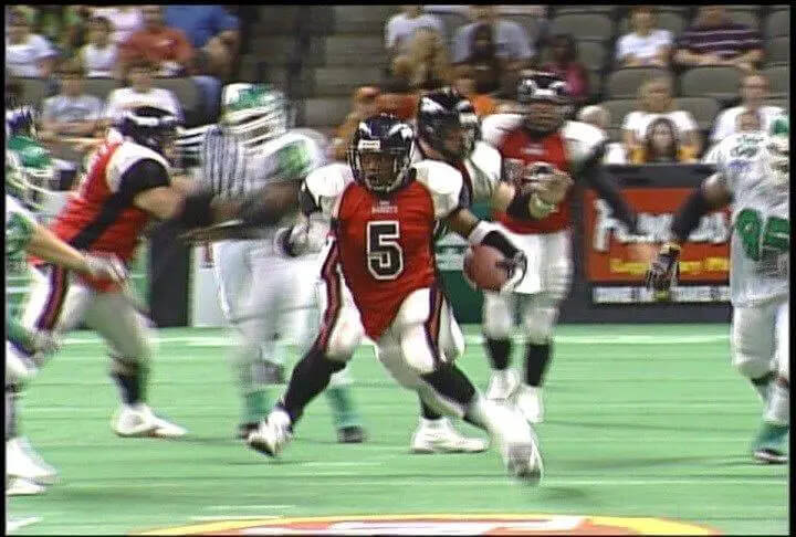 Fred Jackson runs past defenders with the Sioux City Bandits, an indoor league football team