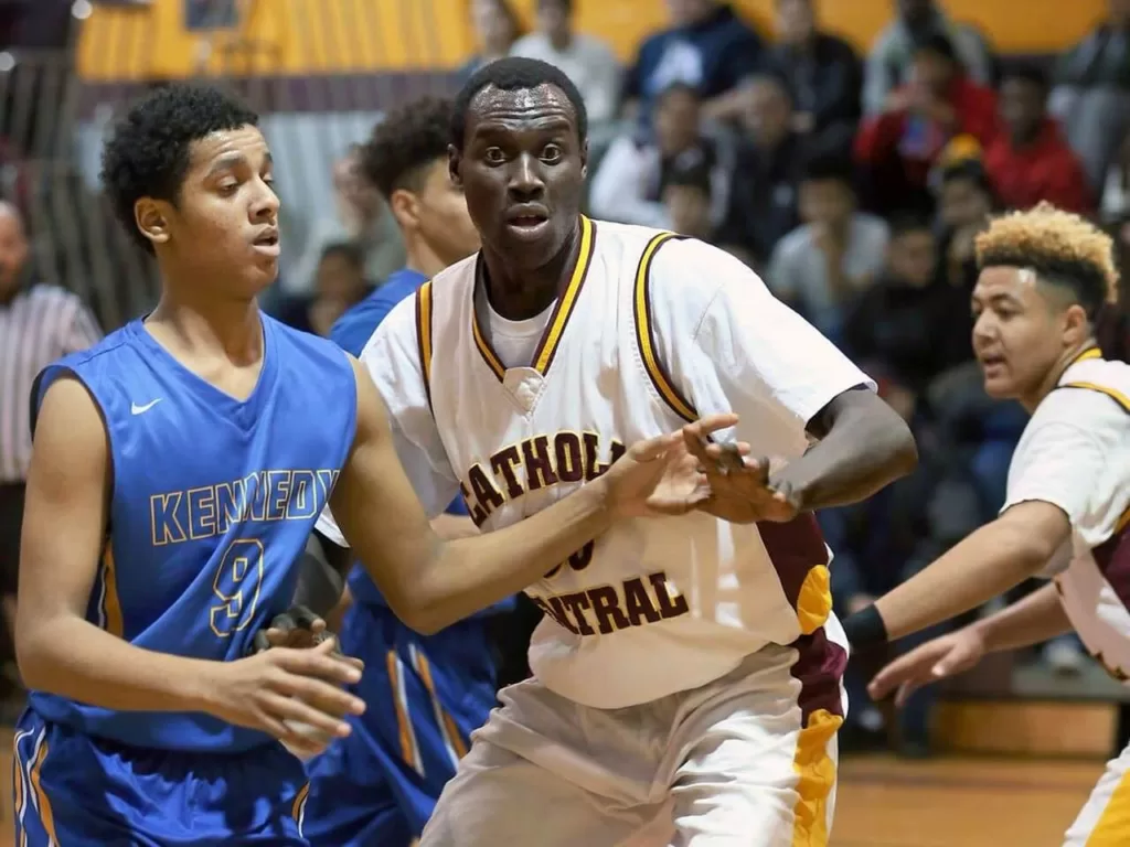 29 year old Jonothan Nicola plays in a high school basketball game for Catholic Central