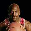 An illustration of Michael Jordan holding a basketball in his Chicago Bulls jersey headlines our article about Jordan's best quotes